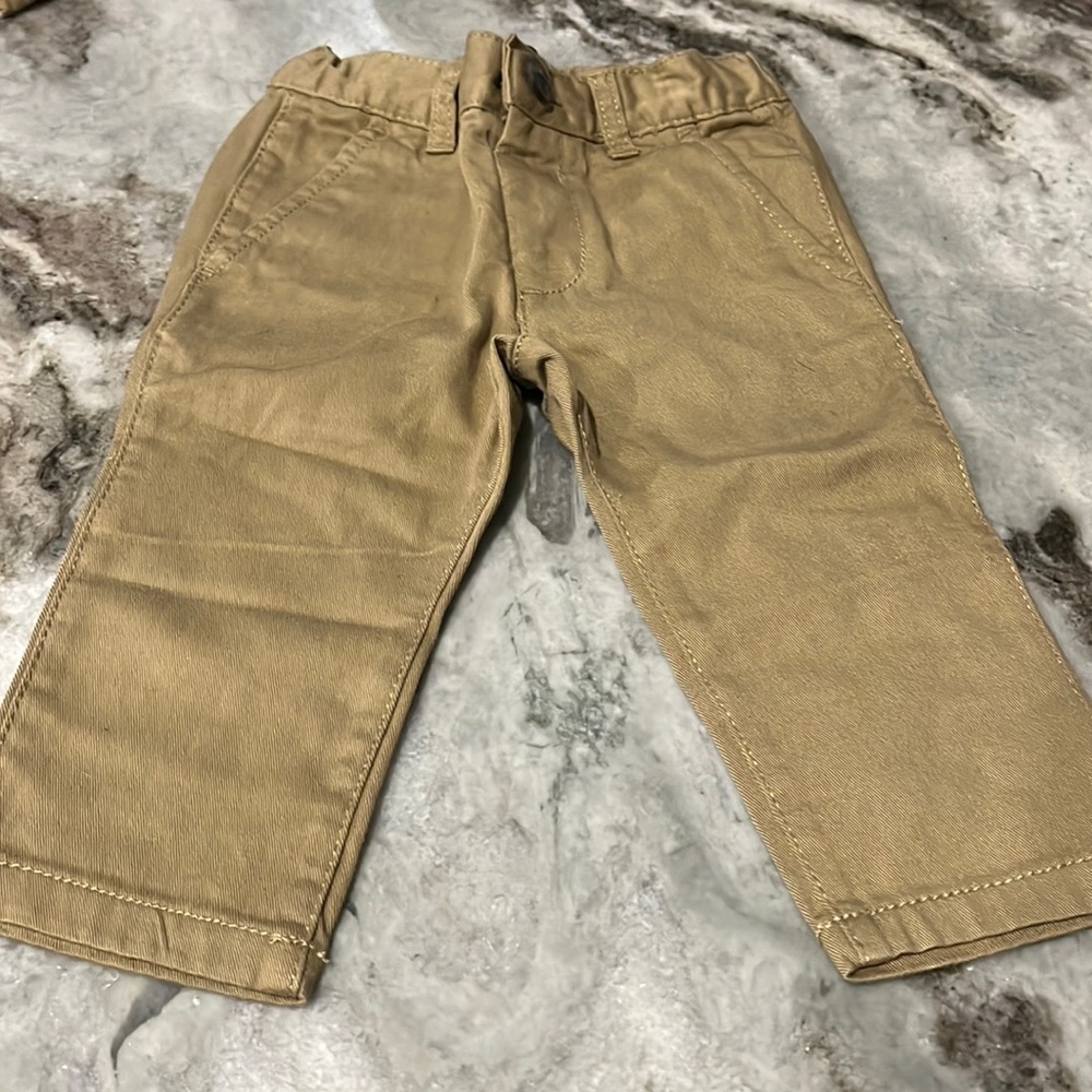 the Children’s Palace tan slacks